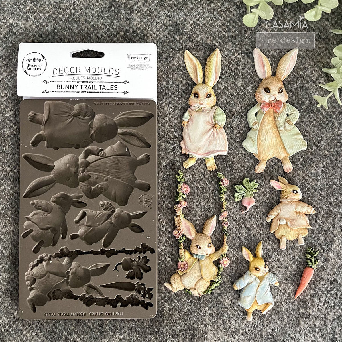 Decorative bunny-themed mold set with finished bunny figures on a textured surface.