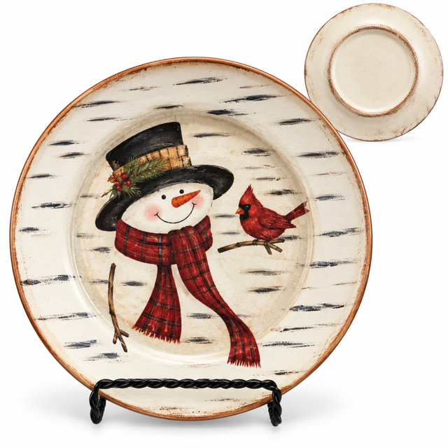 A round decorative plate with a winter snowman and cardinal design, displayed on a black stand with a smaller inset view of the back of the plate on a white background.