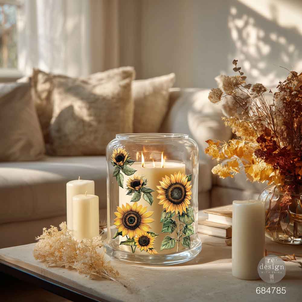 Decorative candle holder with sunflower design on a table in a living room.