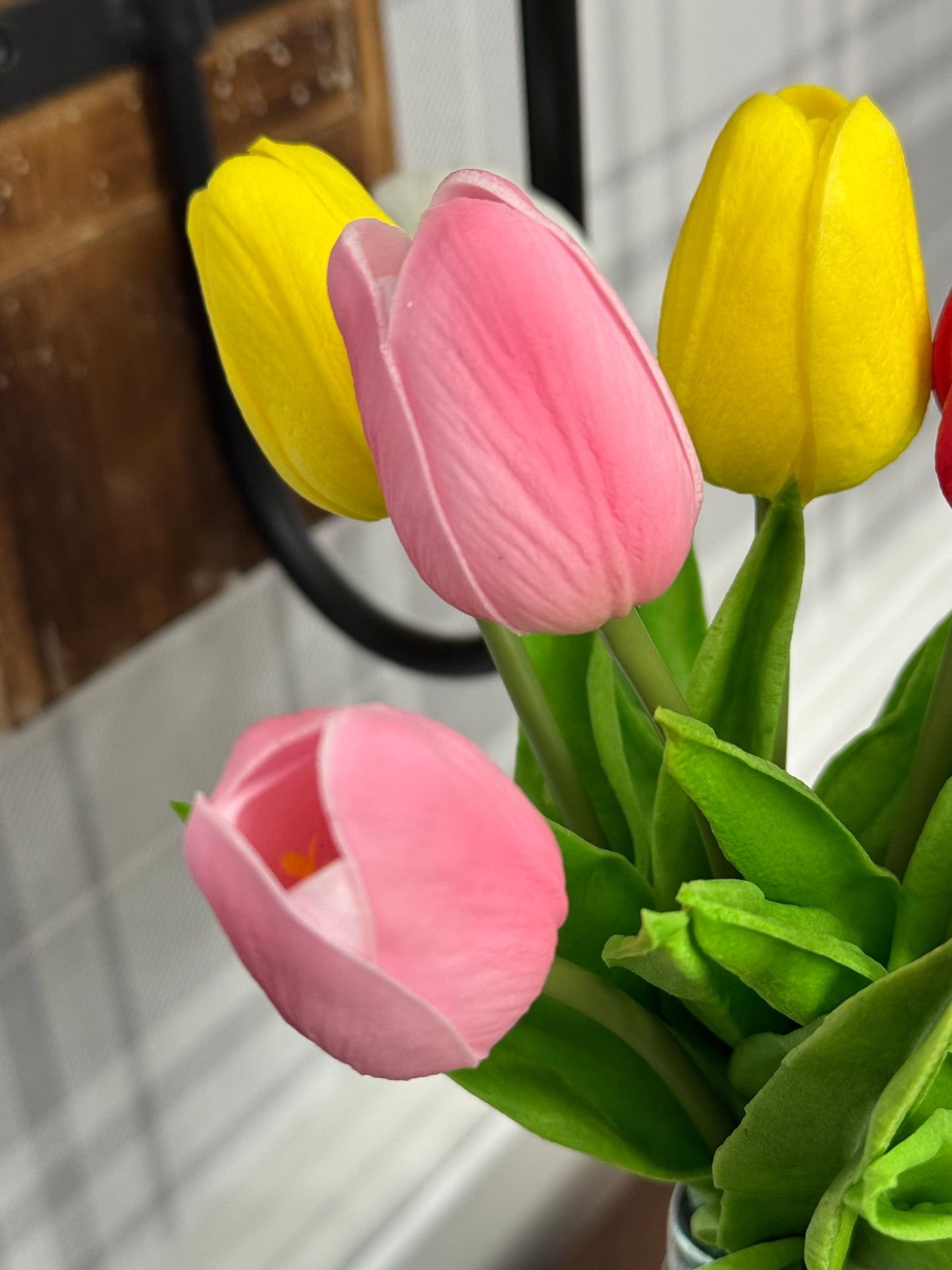 Bouquet of pink and yellow tulips with a blurred background