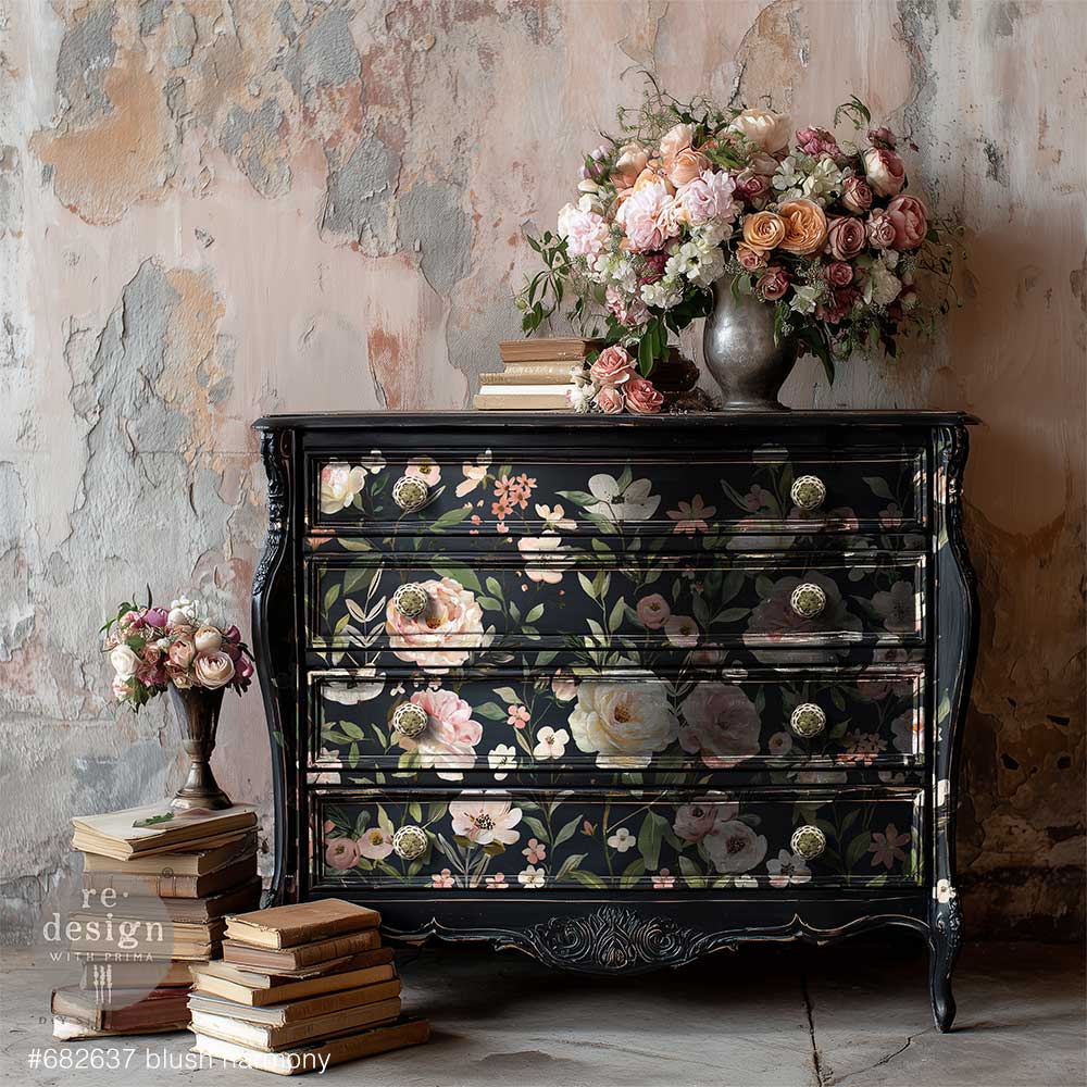 Soft, romantic, and effortlessly graceful, Blush Harmony is a dreamy floral transfer designed to bring lightness and elegance to any surface. Featuring delicate blooms in gentle shades of blush pink, ivory, and soft greenery, this design captures the beauty of freshly gathered garden florals in full, airy composition. on the drawer fronts of  a dark colored dresser