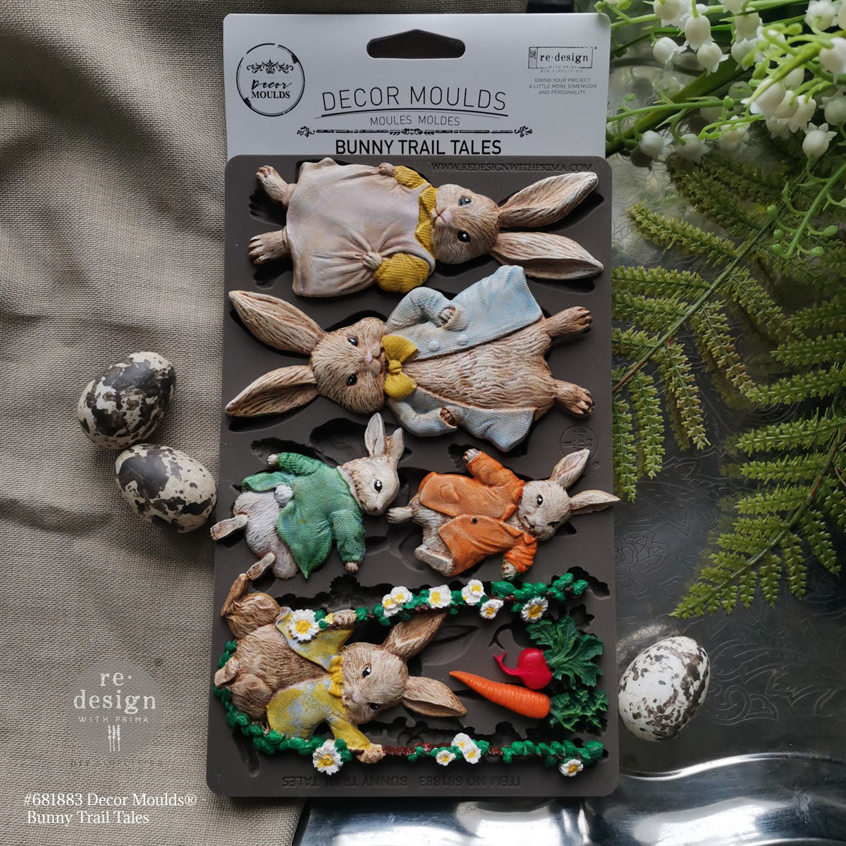 Decorative bunny moults on a packaging with 're-design' branding, surrounded by greenery.