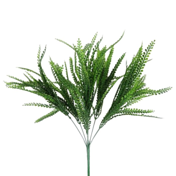 Artificial green fern plant on a white background