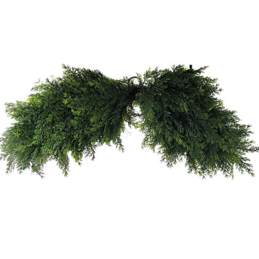 Green artificial wreath on a white background