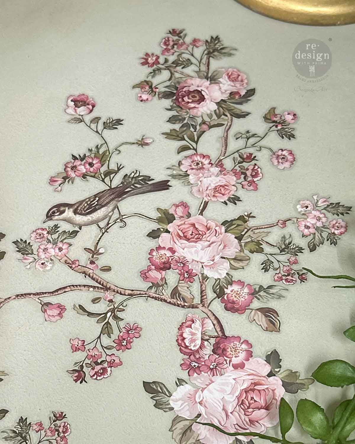 Decorative floral design with pink flowers and a bird on a light background