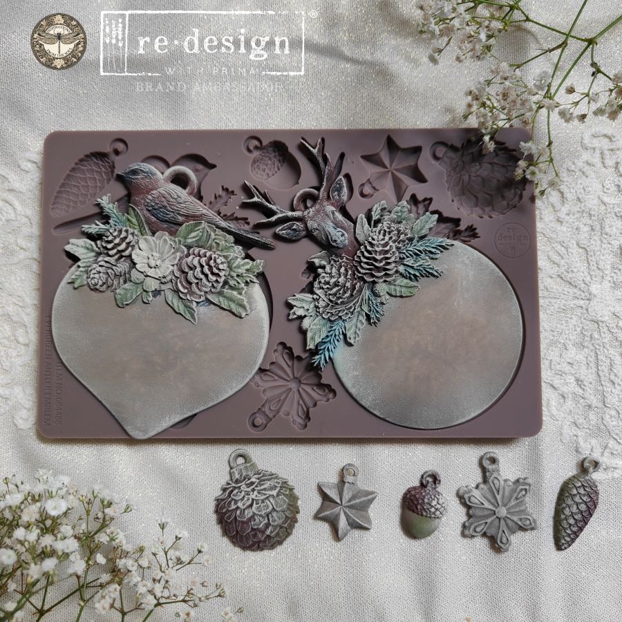 Silicone mold with decorative elements on a textured surface with flowers.