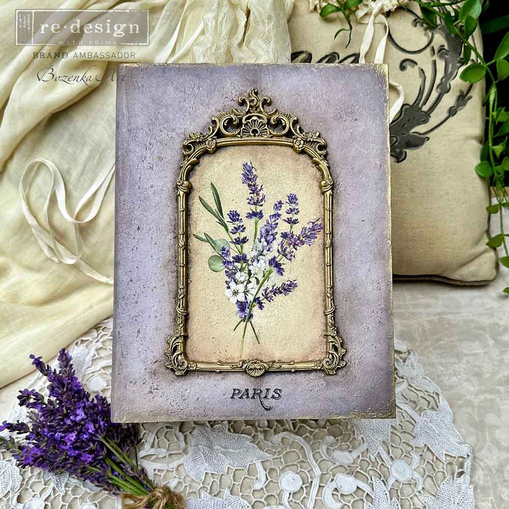 Decorative card with lavender and gold frame on textured surface