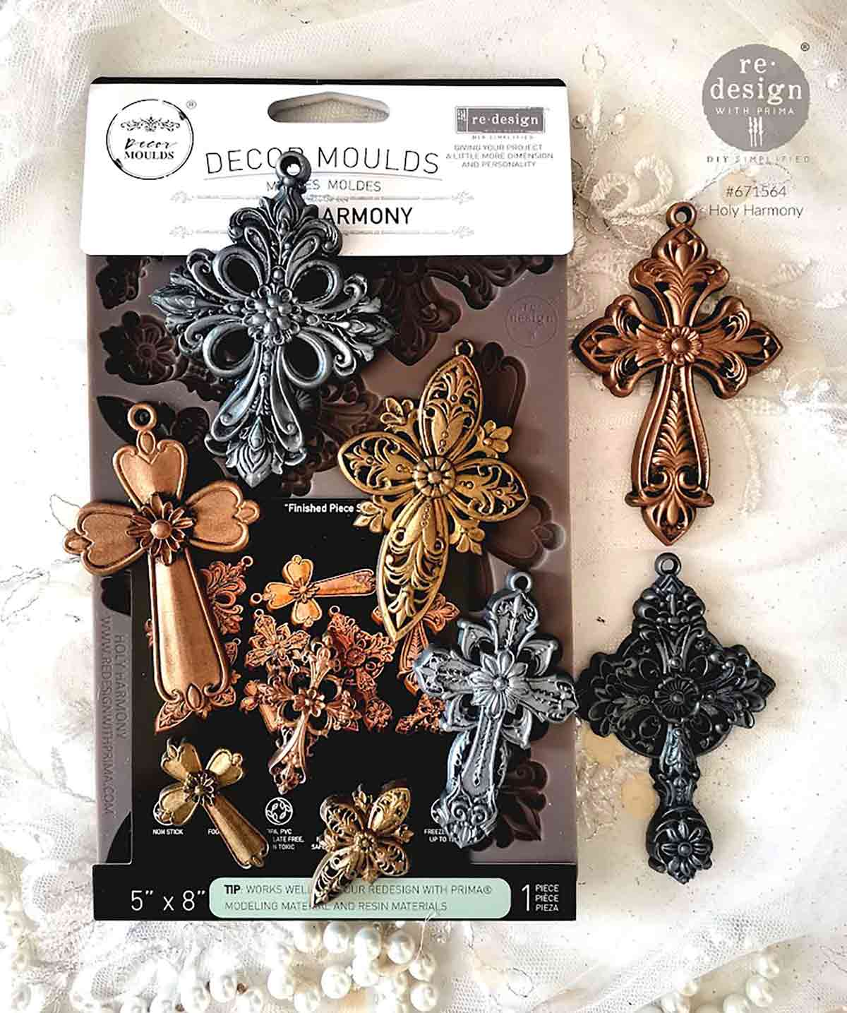 Decorative cross-shaped moulds in packaging with additional crosses on a textured background