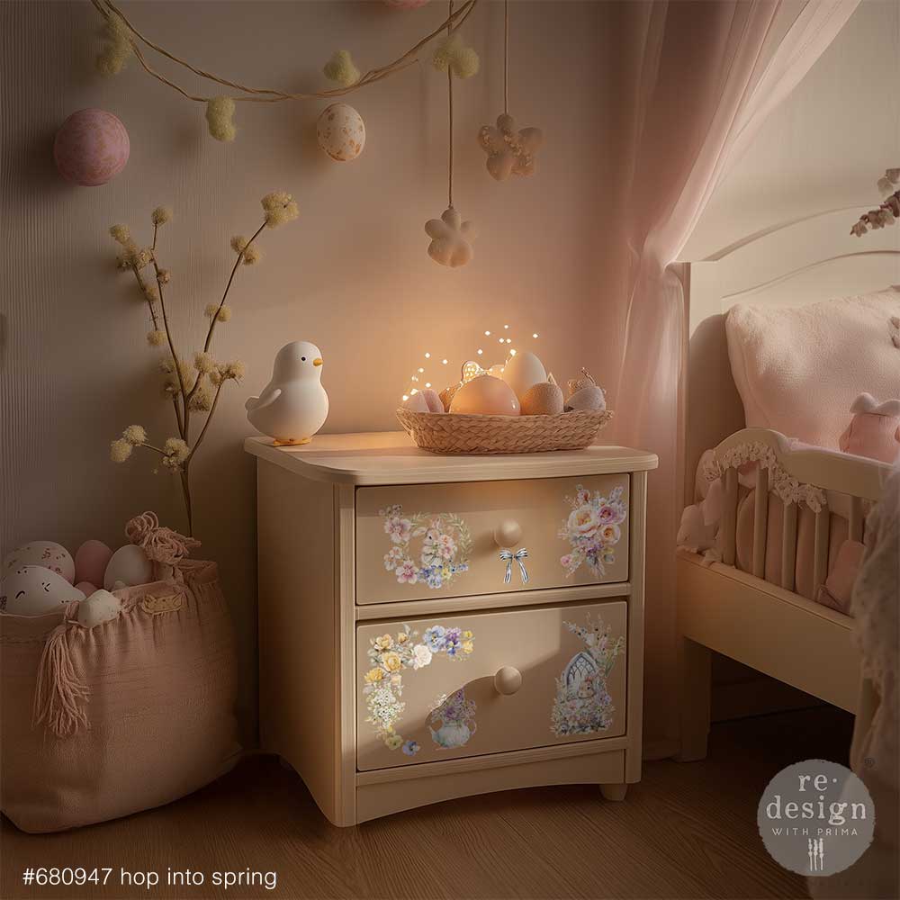 Nursery room with decorative nightstand, basket of eggs, and hanging decorations.