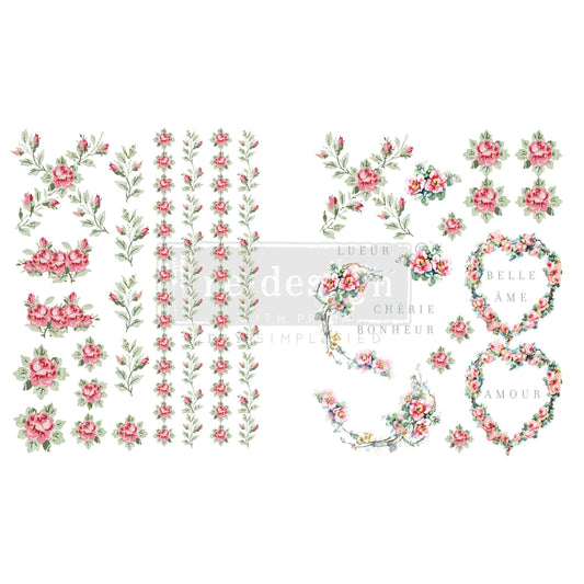 Set of floral elements including flowers, leaves, and decorative letters on a white background.