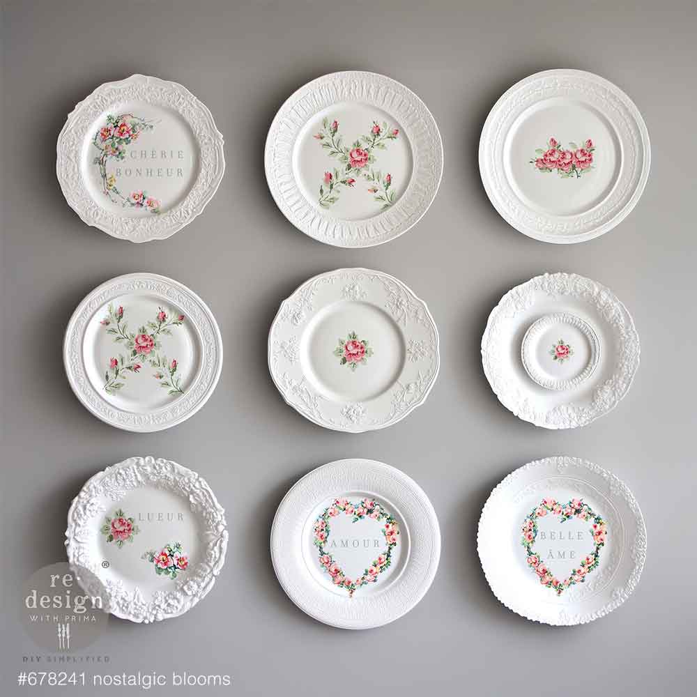 Set of decorative plates with floral designs on a gray background