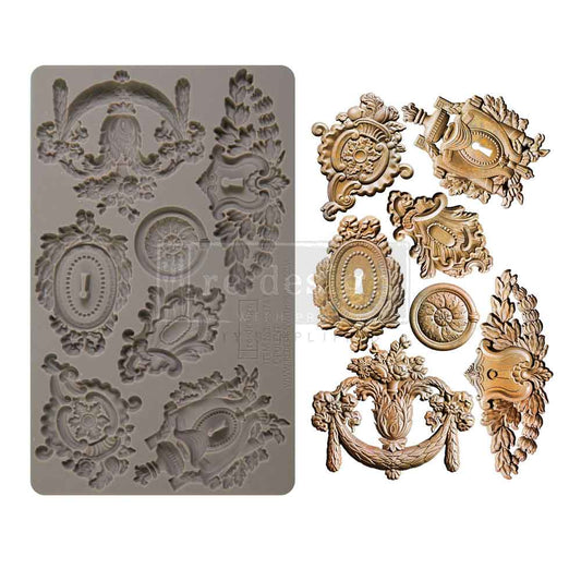 Decorative molding mold with intricate designs on a white background