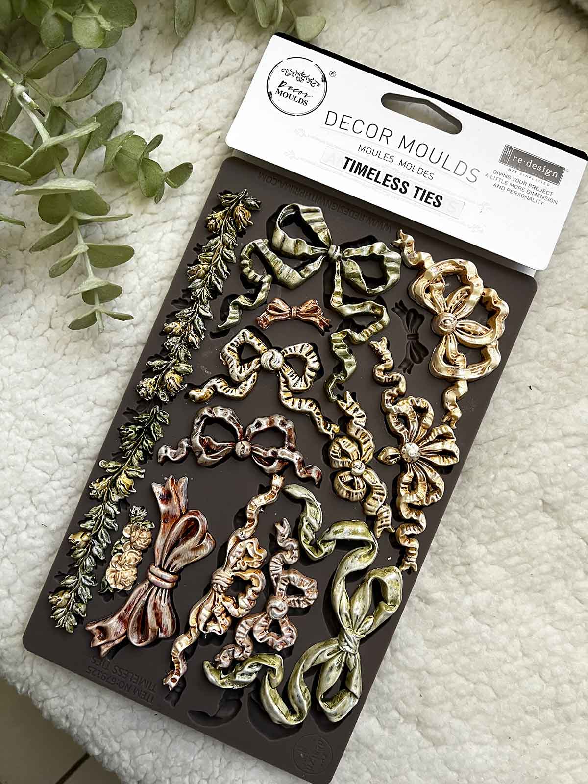 Decorative mold set with 'Timeless Ties' design on a textured surface.